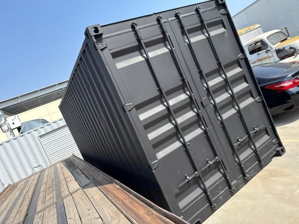518204565_24084520587870168_1359365613162896163_n-1 20ft Used Shipping Container – Matte Black w/ 12’ Side Roll-Up Door