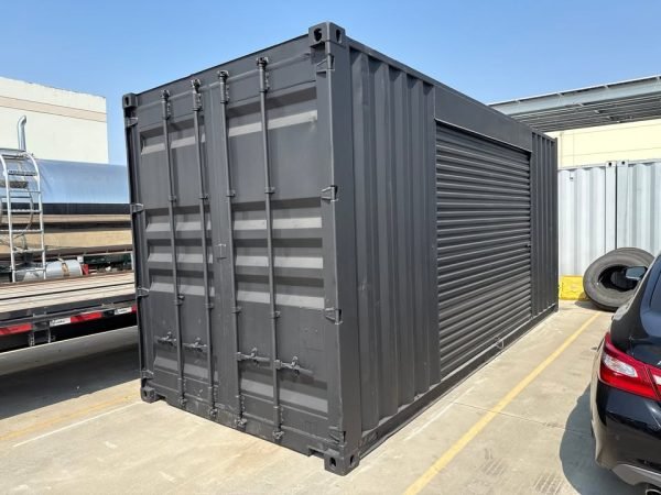 518277105_24084520581203502_1136656330675810502_n 20ft Used Shipping Container – Matte Black w/ 12’ Side Roll-Up Door