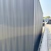 518288731_24084520584536835_7796433739846501905_n 20ft Used Shipping Container – Matte Black w/ 12’ Side Roll-Up Door