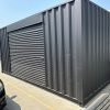 518319815_24084520591203501_6401163788766369853_n 20ft Used Shipping Container – Matte Black w/ 12’ Side Roll-Up Door