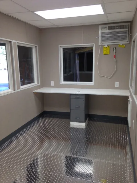 PaulReillyCo-8x12FaureciaGuardhouse-Completion2-1.webp 8×16 Guard Booth-PlanA